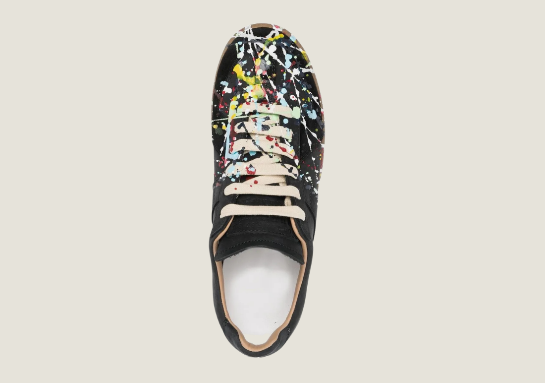 MM nubuck leather and velour featuring a paint splatter design.